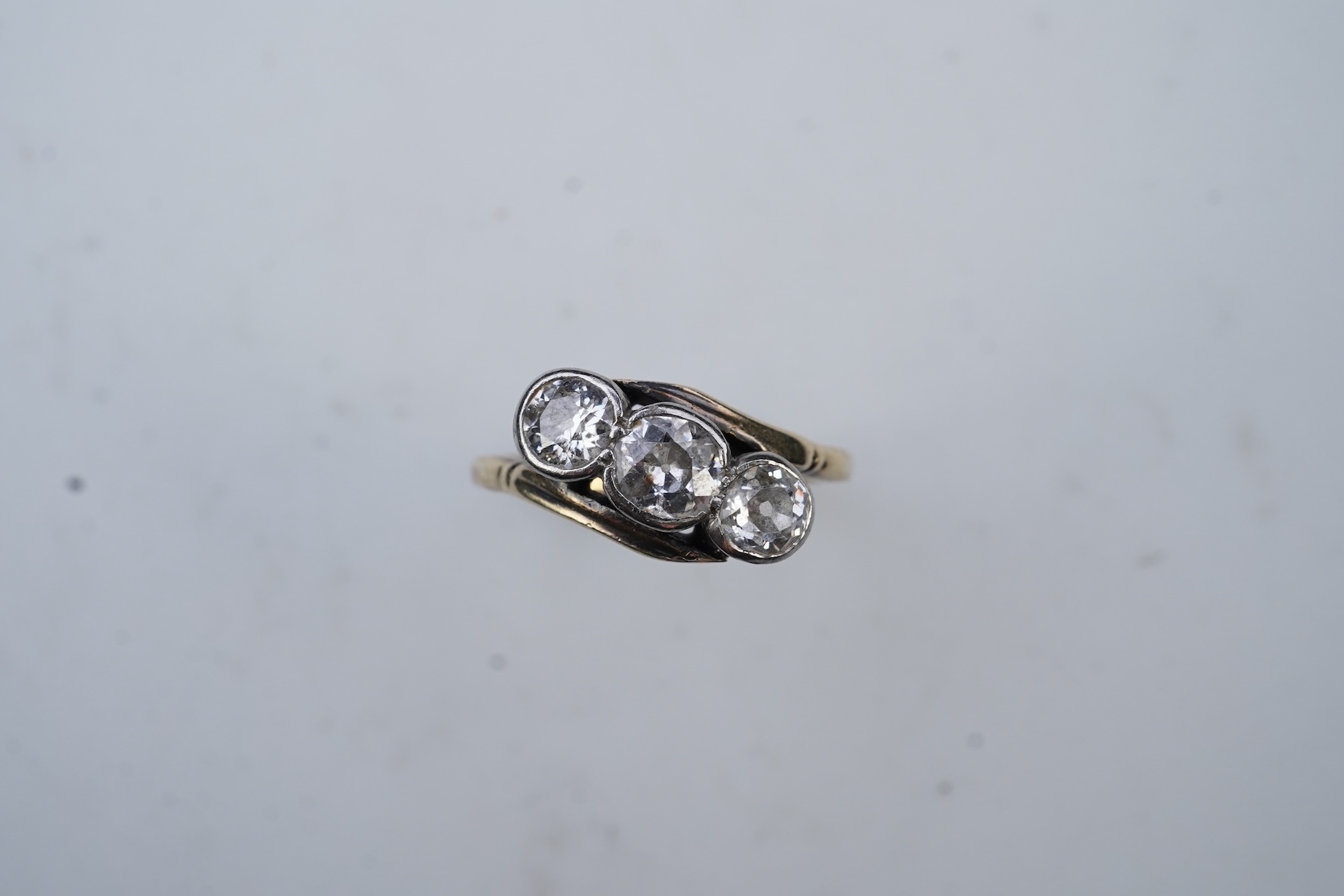 A three-stone diamond ring, early 20th century